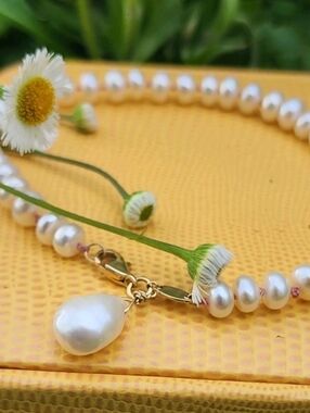 14k Pearl bracelet with charm